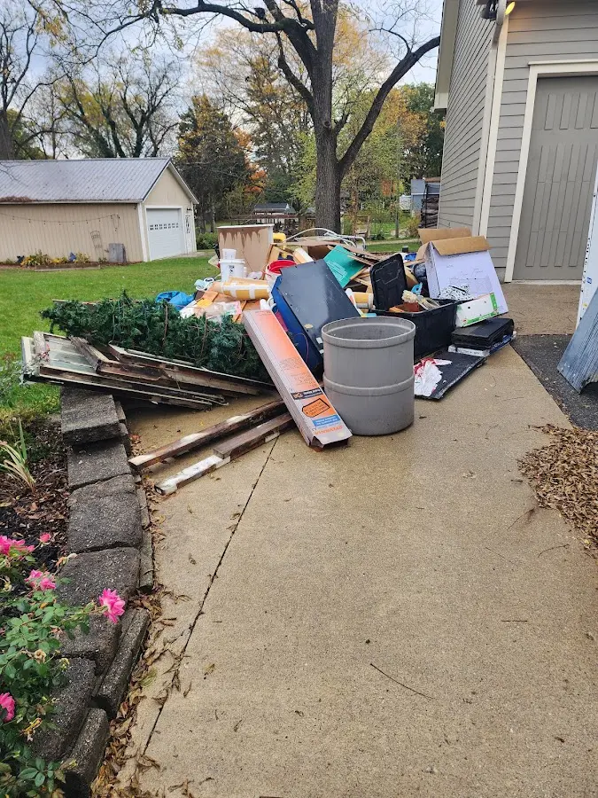 Dumpster being loaded with debris for Roofing Dumpster Rental in Boyertown